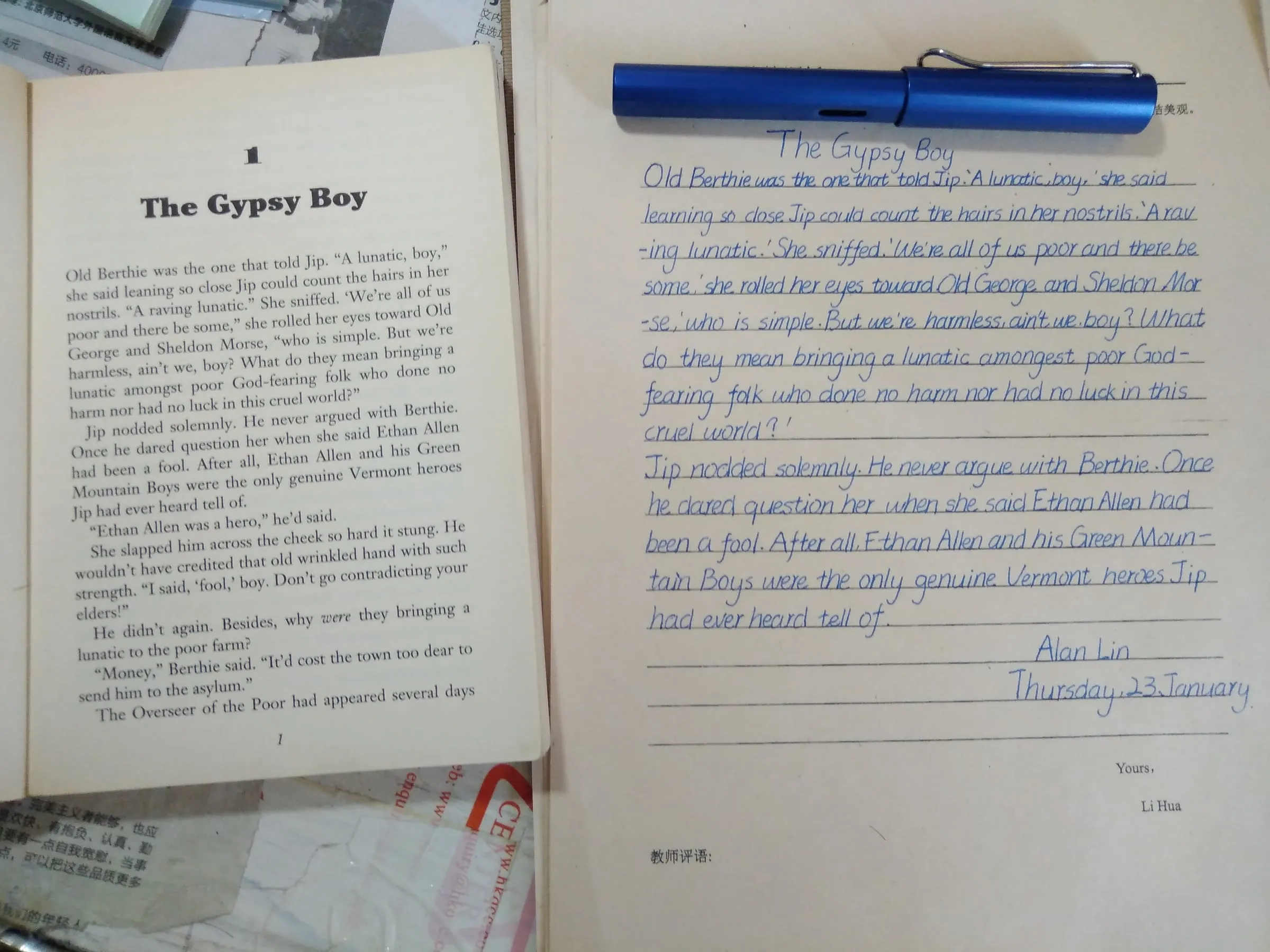A printed page of The Gypsy Boy next to a handwritten copy and a blue pen