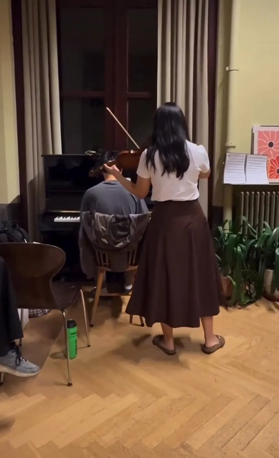 Alan at the piano accompanying a violinist in a living room
